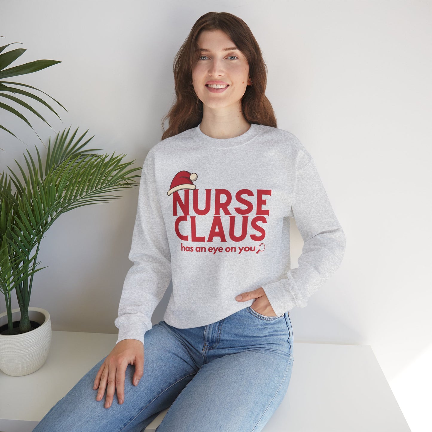 Nurse Claus Crewneck Sweatshirt – Retro Christmas Nurse Gift with Santa Hat & Magnifying Glass